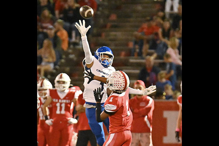 Culver City safety James Wright leaps high to try block a pass by Redondo Union's Cadence Turner during the Centaurs 27-14 win over the Sea Hawks last Friday at Redondo. PHOTO BY GEORGE LAASE